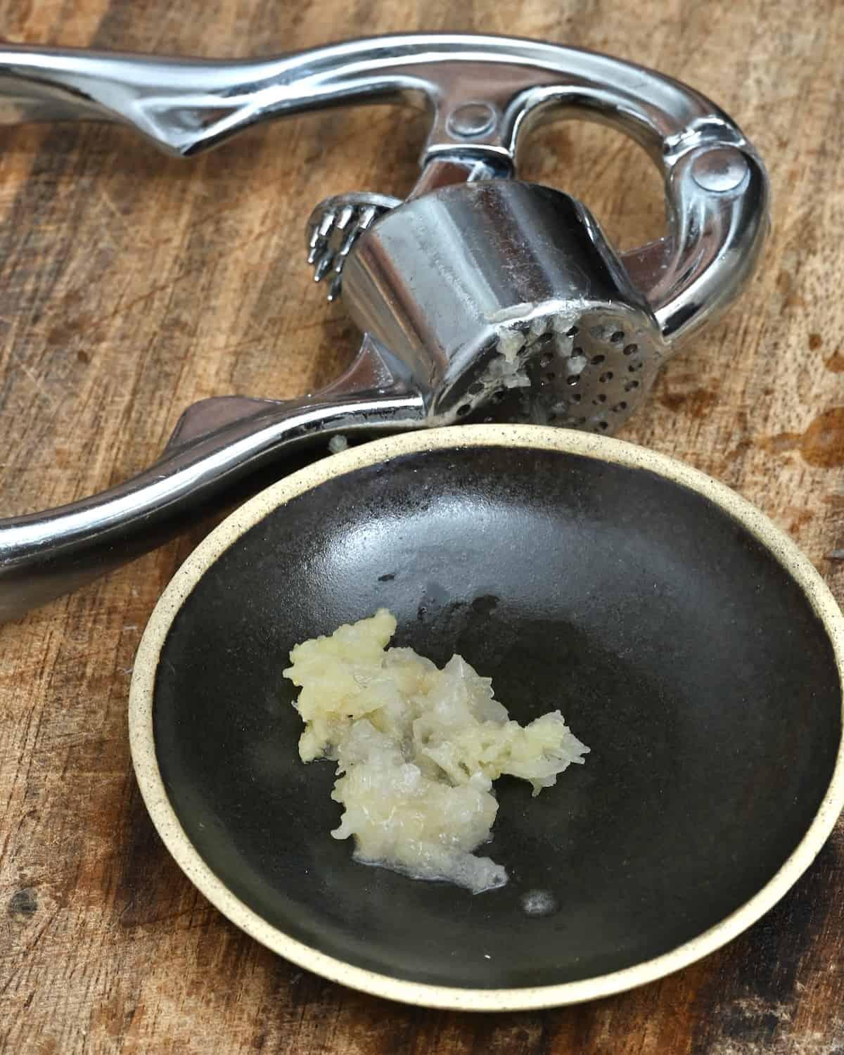 Minced garlic clove on a small plate