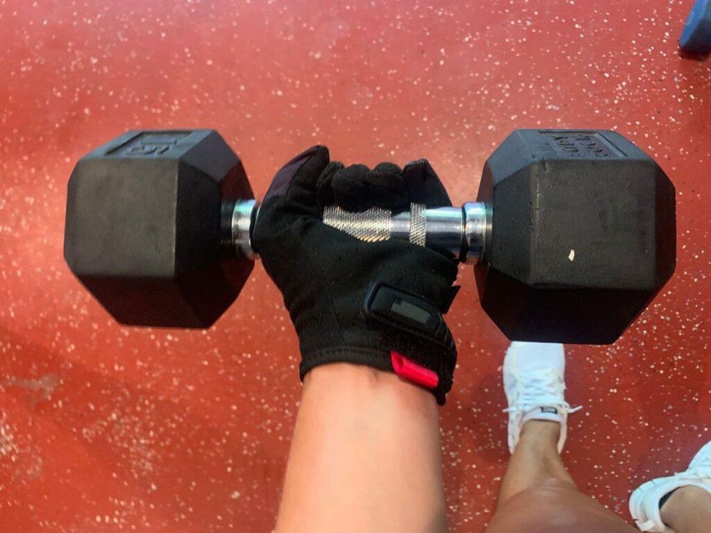 Mechanix Gloves holding a hex dumbbell