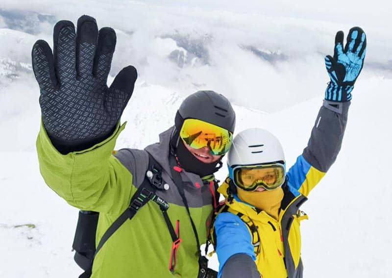 ski and snowboard gloves waving