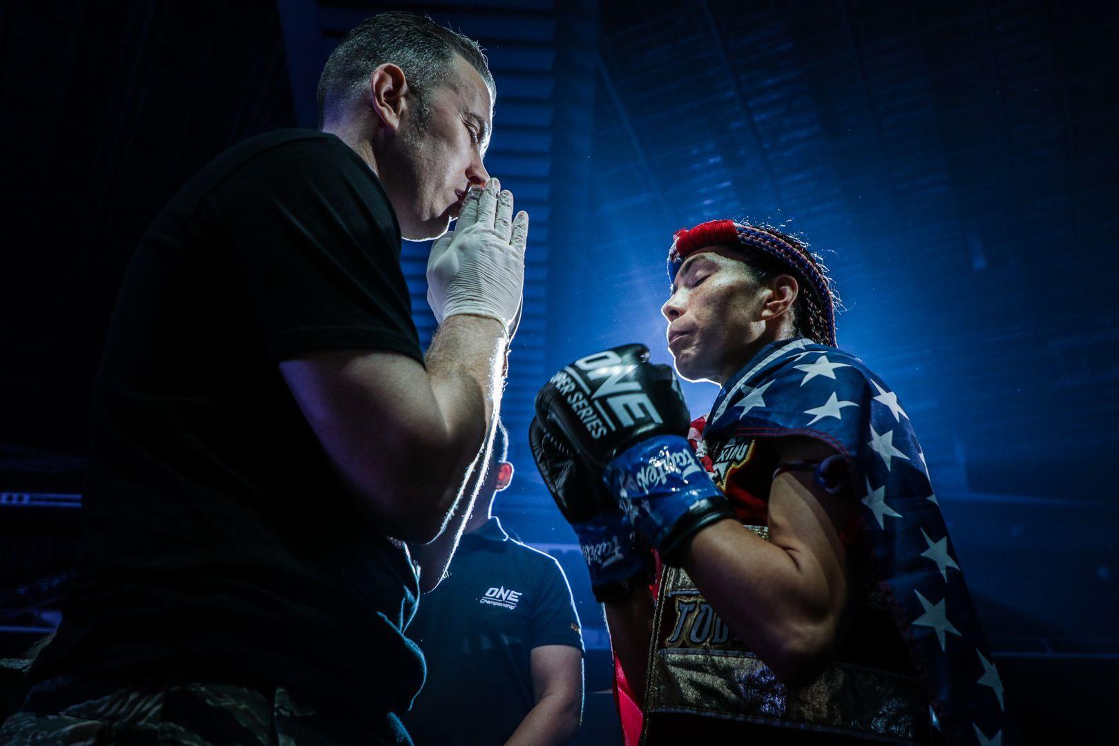 Janet Todd Shares A Prayer With Her Cornerman Before Her Match Against Stamp Fairtex