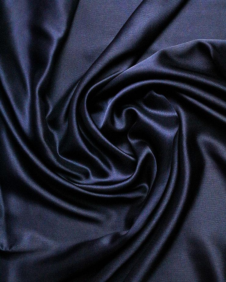 black silky fabric in a swirl