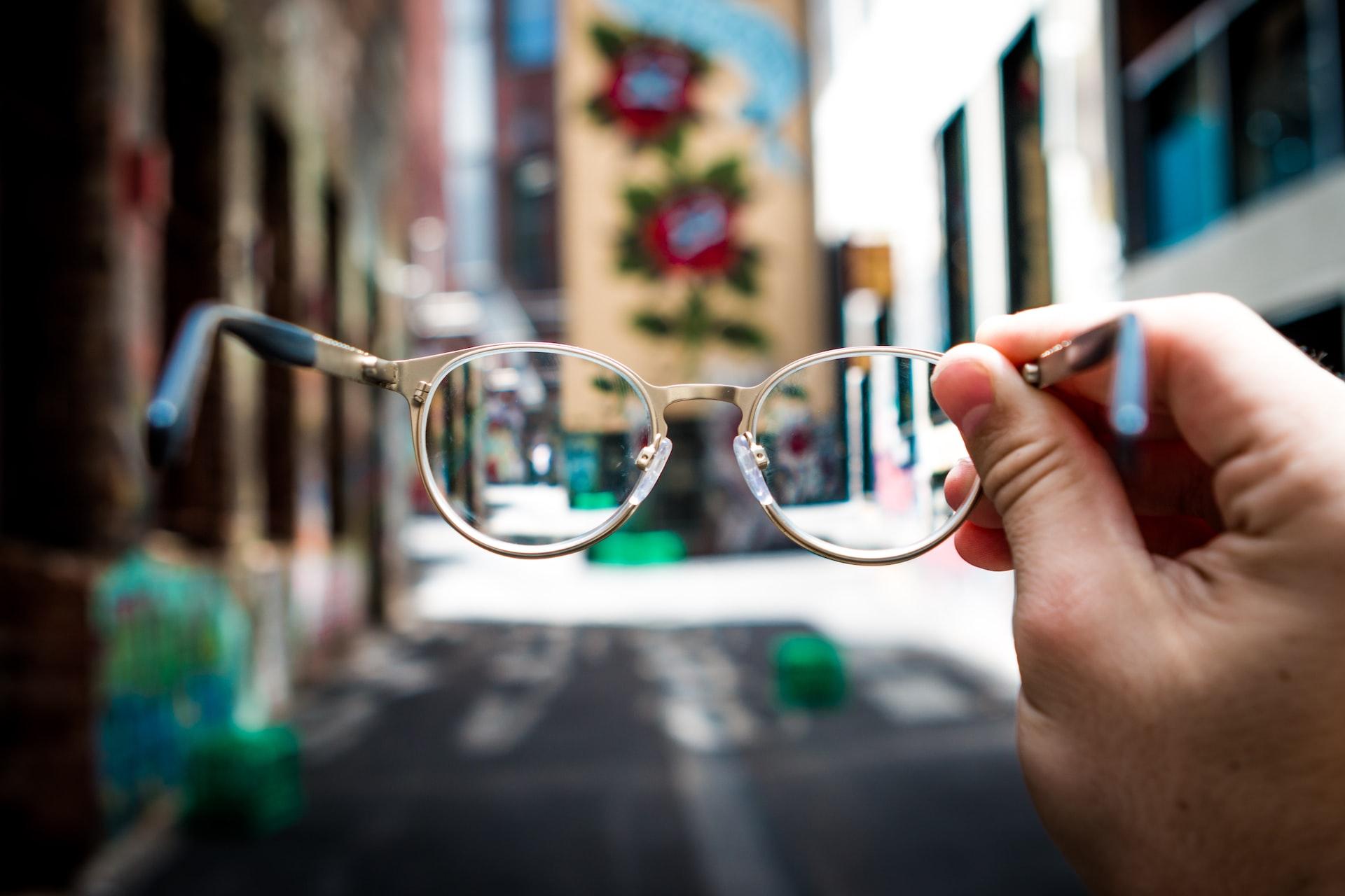 Glasses held up to see