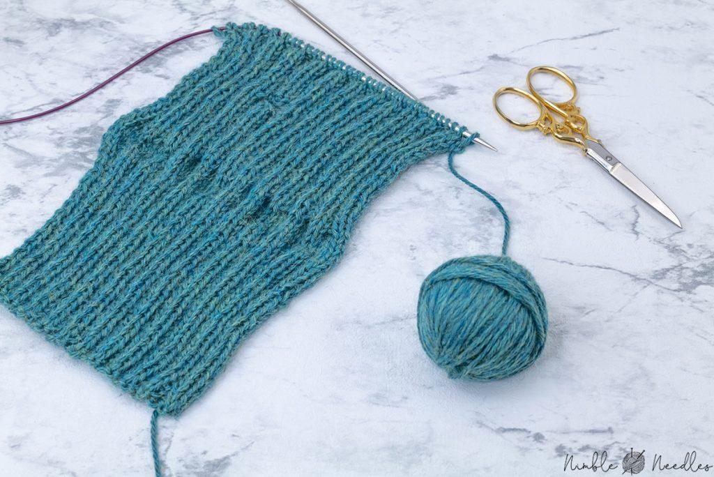 knitting across the increases for the thumbhole carefully