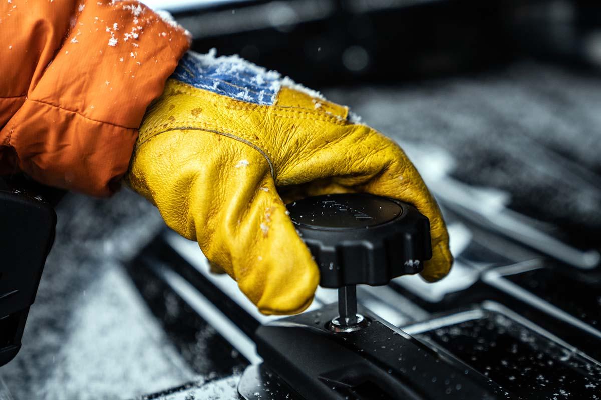 Adjusting cargo box mount with Flylow leather glove