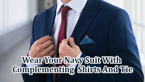 Wear Your Navy Suit With Complementing Shirts And Tie