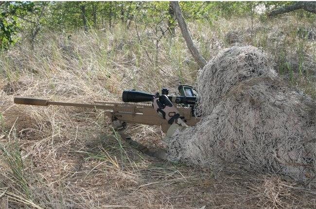 sniper with a ghillie suit