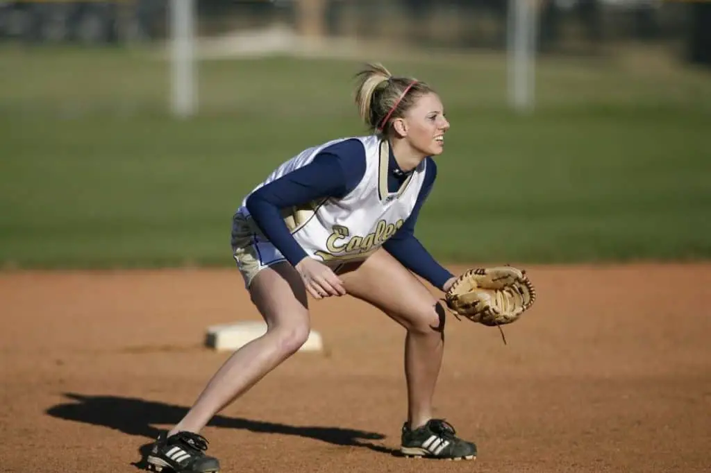 Female softball player in shortstop position.