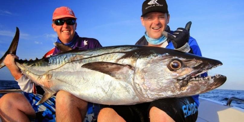 An angler holding a Longtail Tuna