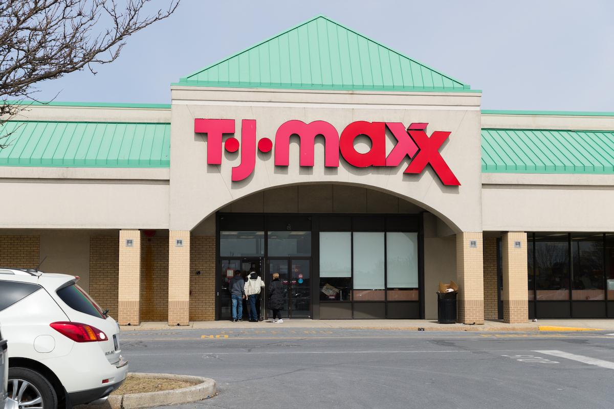 The front of a TJ Maxx store with a green roof and red logo