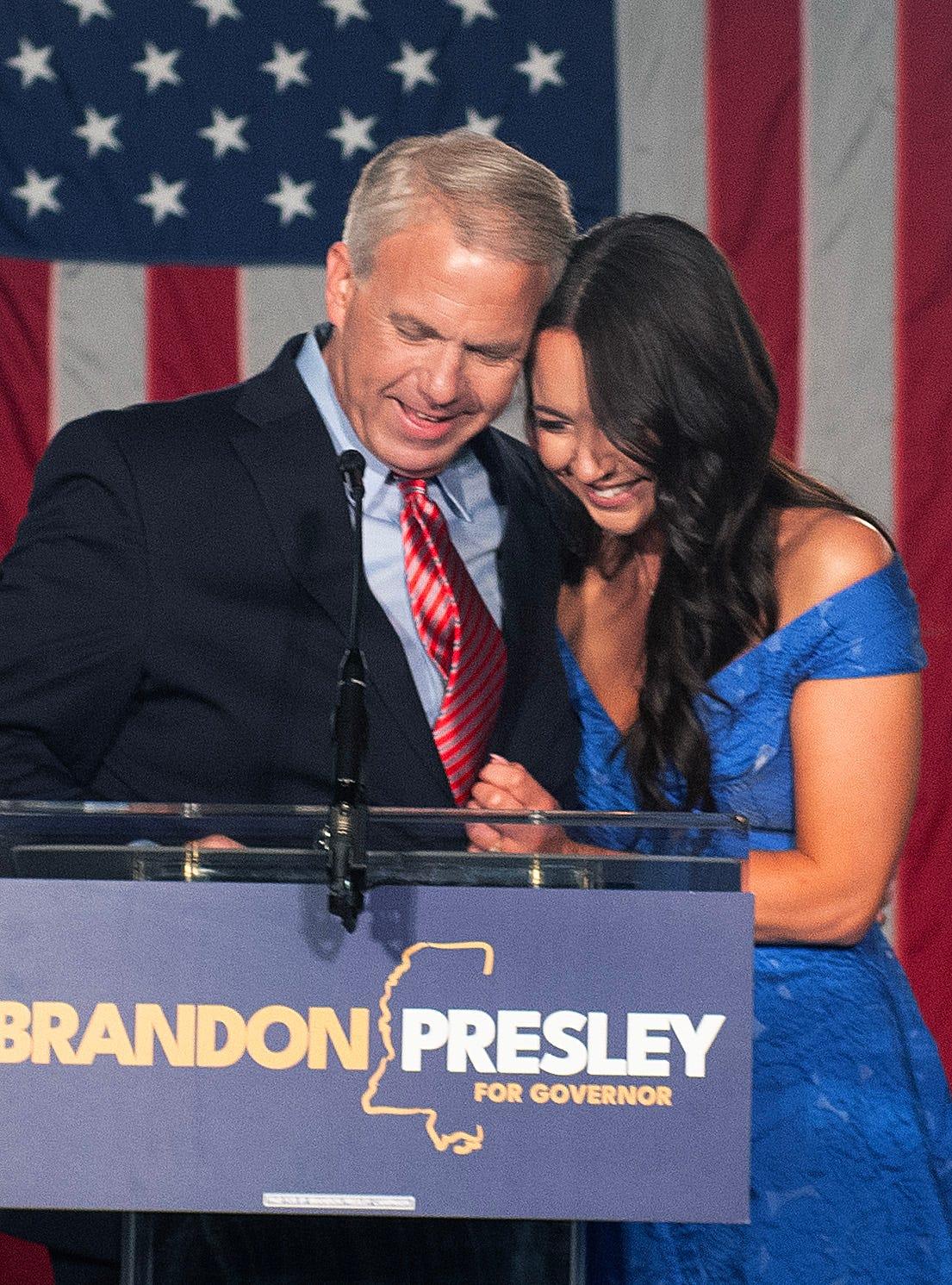 Brandon Presley and his wife Katelyn Presley hug after the Democratic gubernatorial candidate conceded to incumbent Republican Tate Reeves at The Faulkner in Jackson, Miss., Tuesday, Nov. 7, 2023.