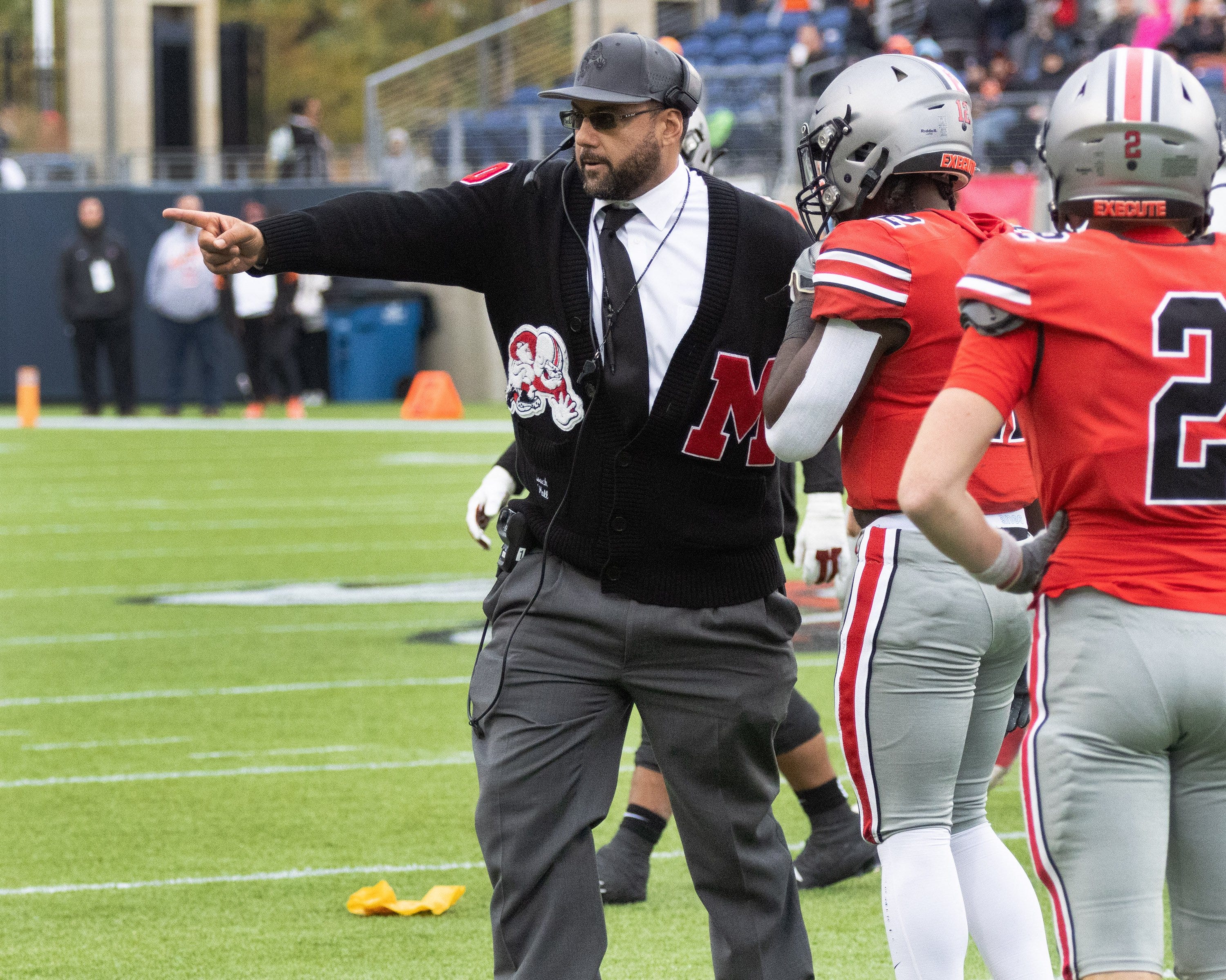 McKinley’s head coach Antonio Hall motions players to the sideline after multiple flags during the fourth quarter of their game against Massillon, Saturday, Oct. 21, 2023.