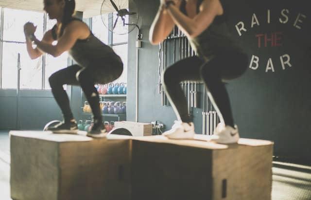 girls working on themselves by going to the gym