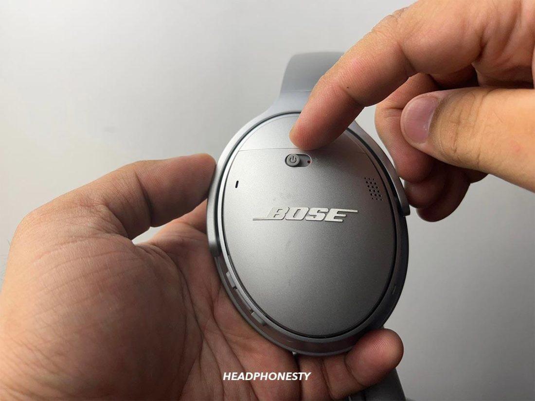 Using a pair of cutting pliers to open the casing of the earbuds. (From: Youtube/Creative & Duck)