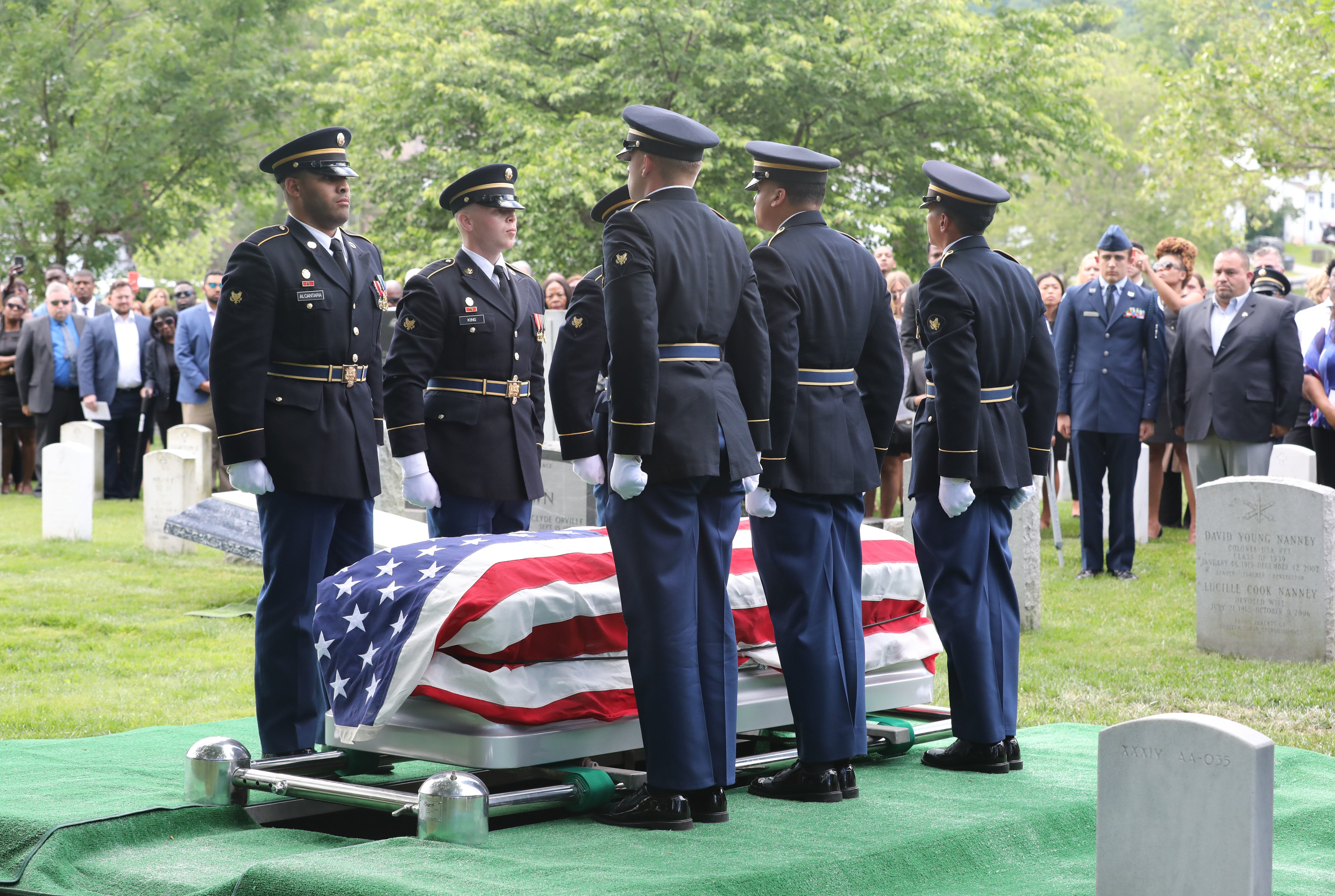 The military honor guard stand at attention over the casket of West Point Cadet Christopher J. Morgan