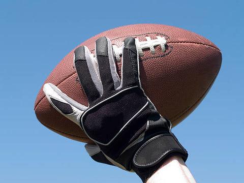 Proper storage of football gloves for maintenance.