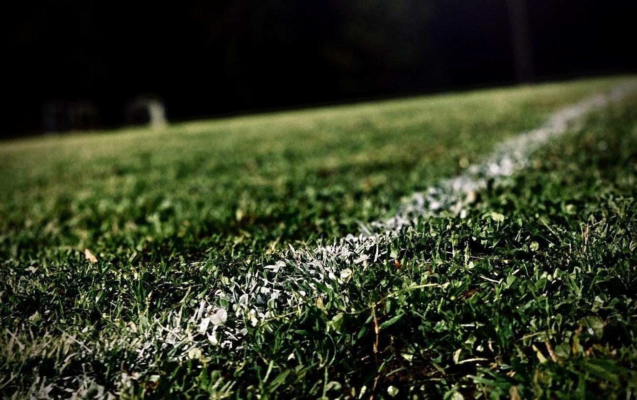 A close up of a line on a football field.