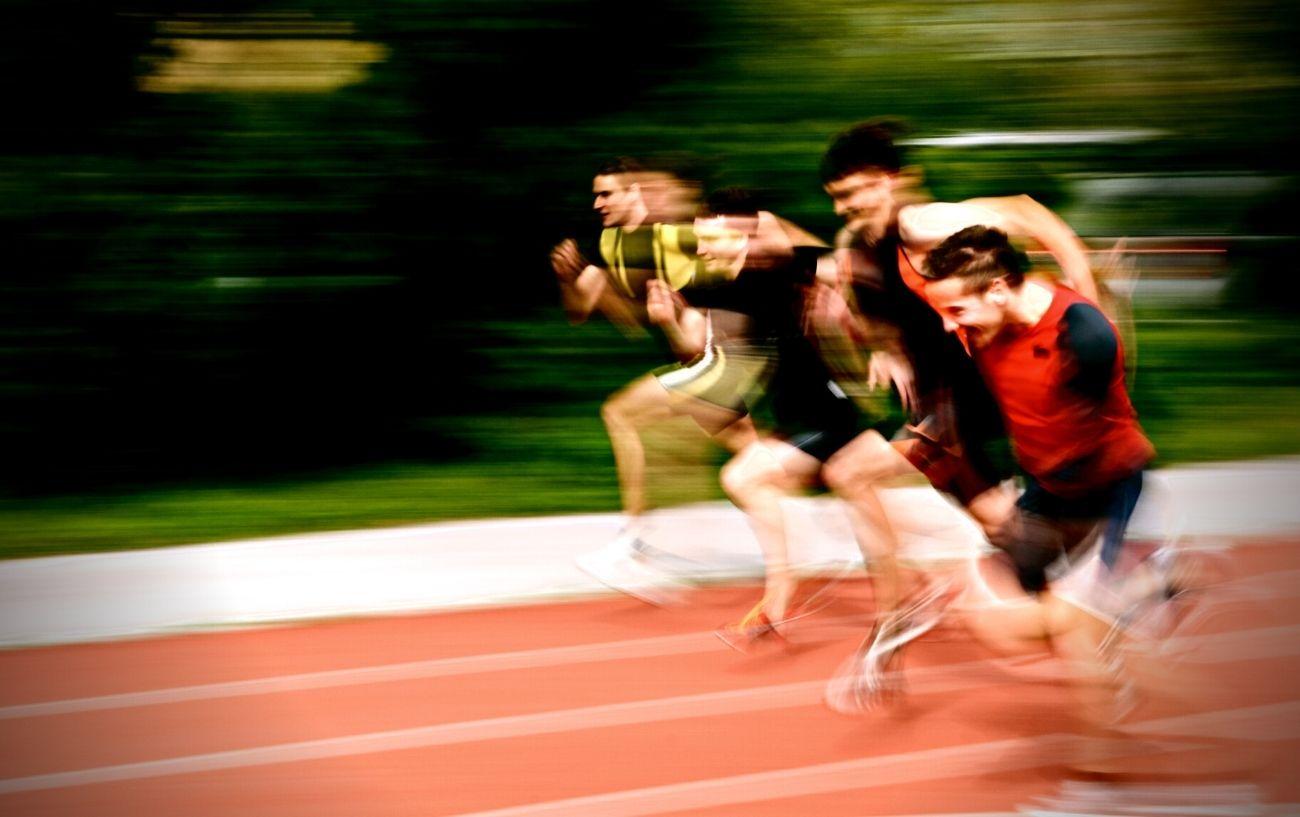 A group sprinting on a track.