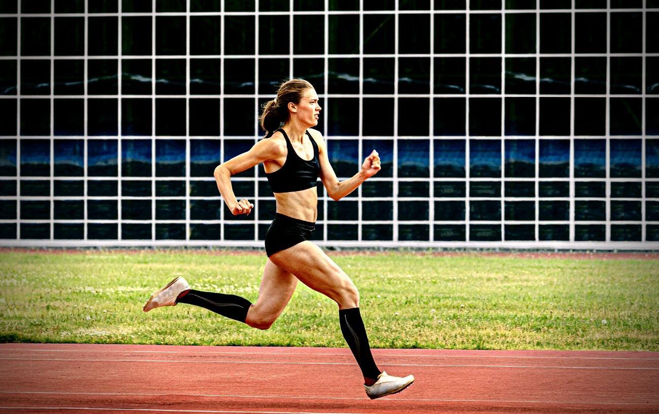A person sprinting on a track.