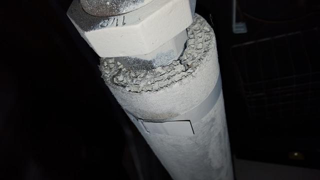 Asbestos pipe wrap looks corrugated