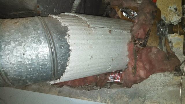 This photo shows corrugated asbestos duct insulation