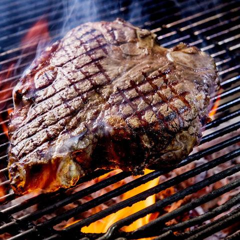steak on fire grill