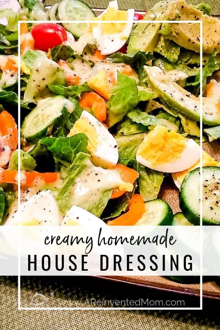 A plate filled with green salad with cucumbers, carrots, boiled egg & Creamy Homemade House Dressing | A Reinvented Mom