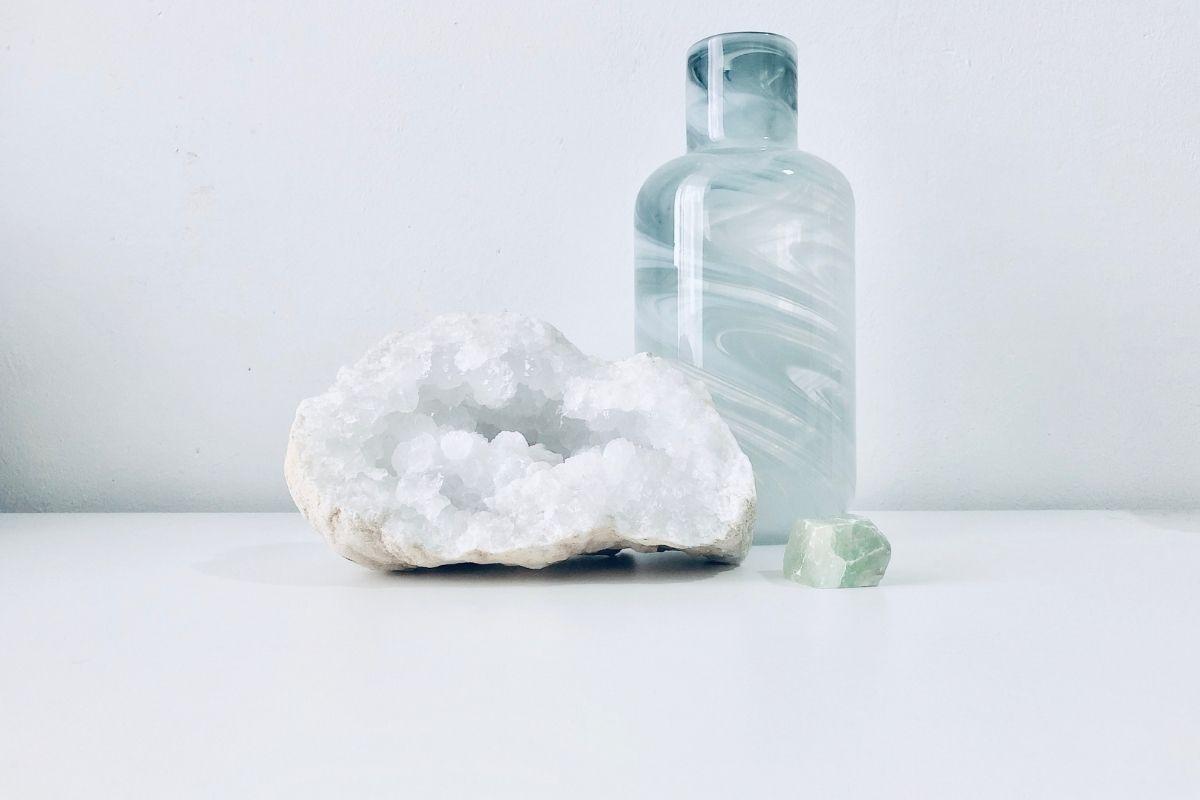 gemstone with quartz and glass bottle