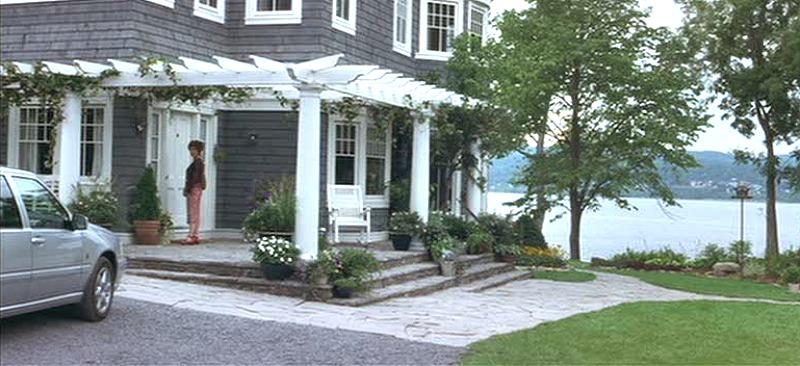 What Lies Beneath house front porch water view