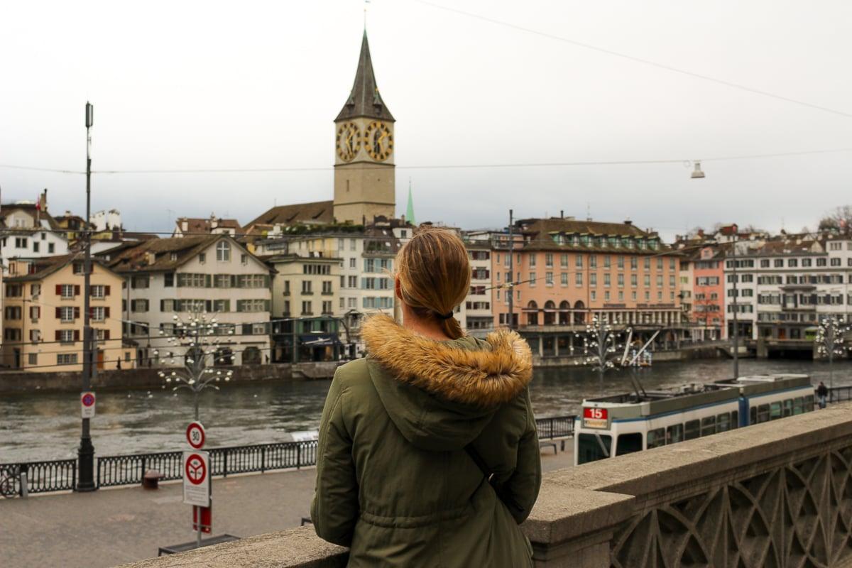 Maddy looking out over the Limmat River and the old, ornate buildings in downtown Zurich