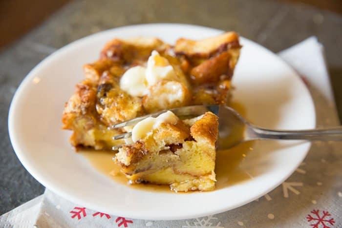 Serving of Cinnamon Rolls French Toast Casserole in White Plate