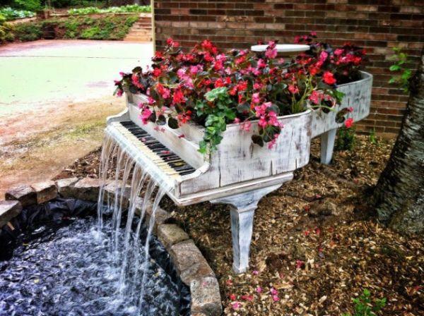 old-piano-turned-into-outdoor-fountain