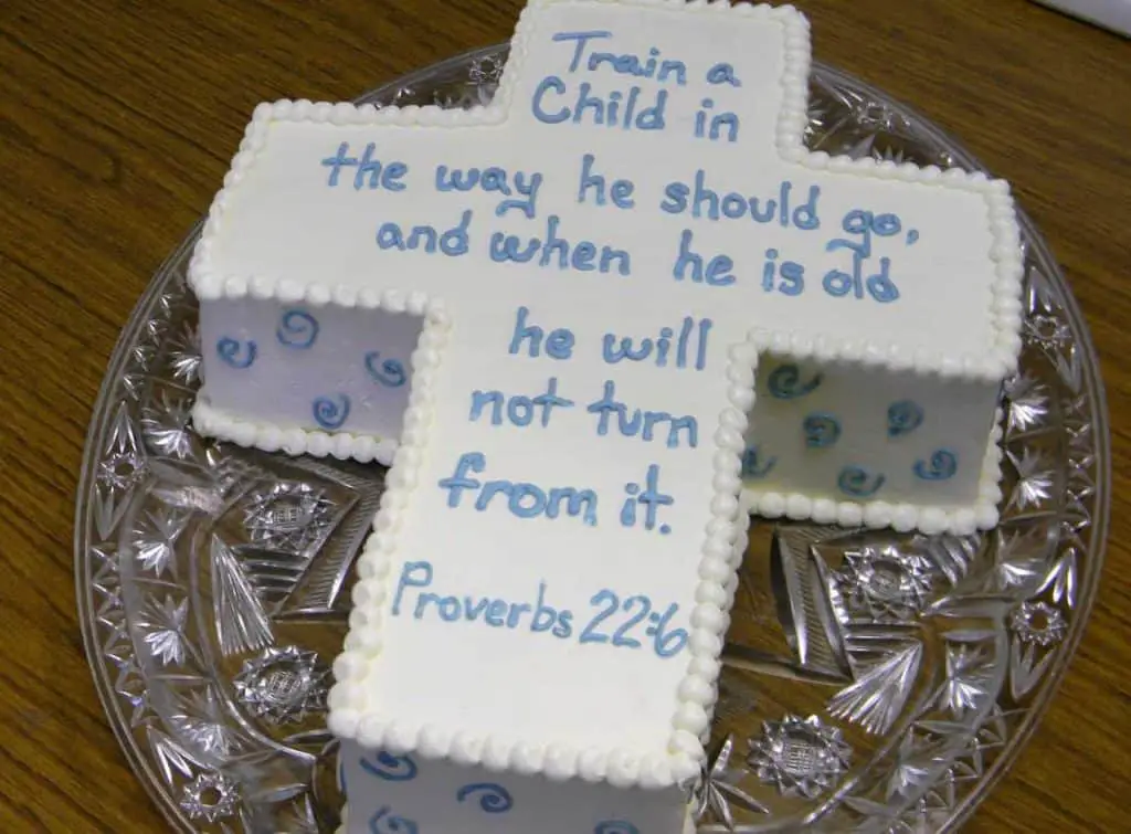 Stay within the theme of cross-shaped cake! - What to Write on Baptism Cake | Baby Journey