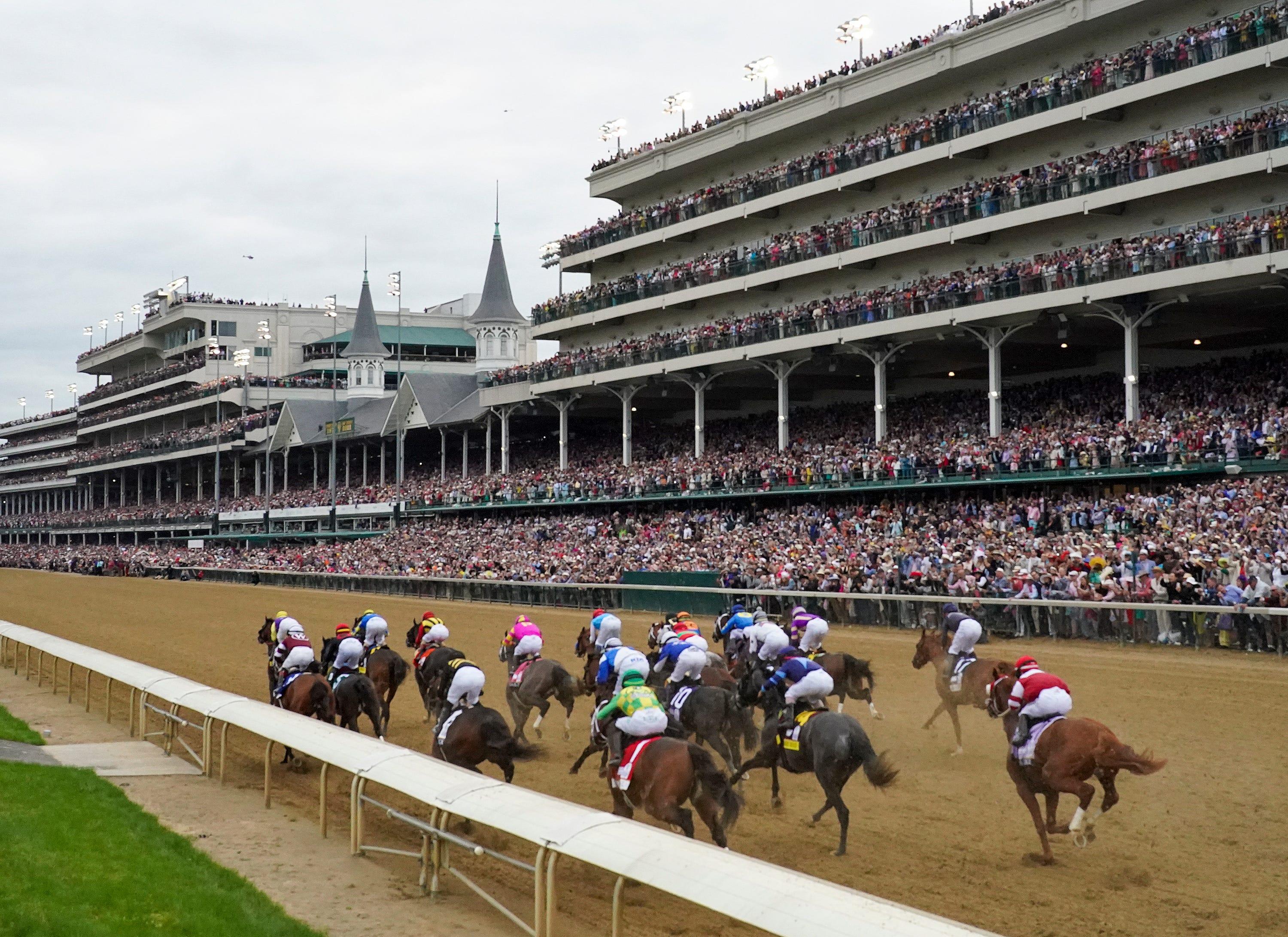 The field for the 148th running of the Kentucky Derby passes the grandstands on Saturday, May 7, 2022