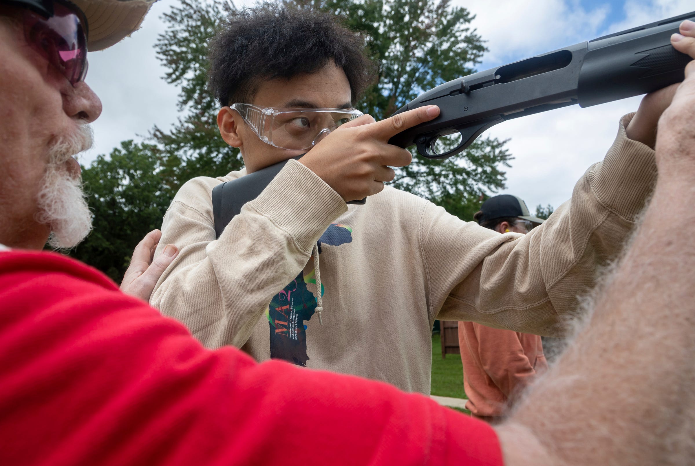 Yifei Jiang, a transfer student at the University of Michigan, prepares to shoot a clay target during a Hunter Safety Field Day at the Washtenaw Sportsman