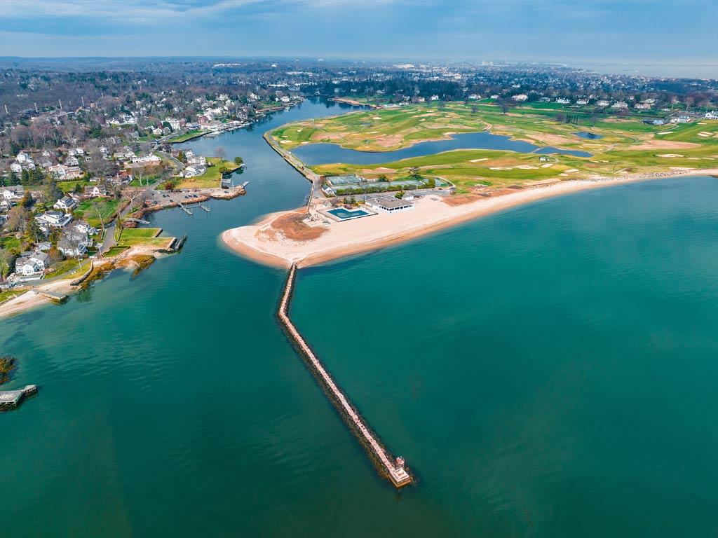 A an aerial view of the entrance to the Southport Harbor in Fairfield, CT, one of the most important harbors in the state.