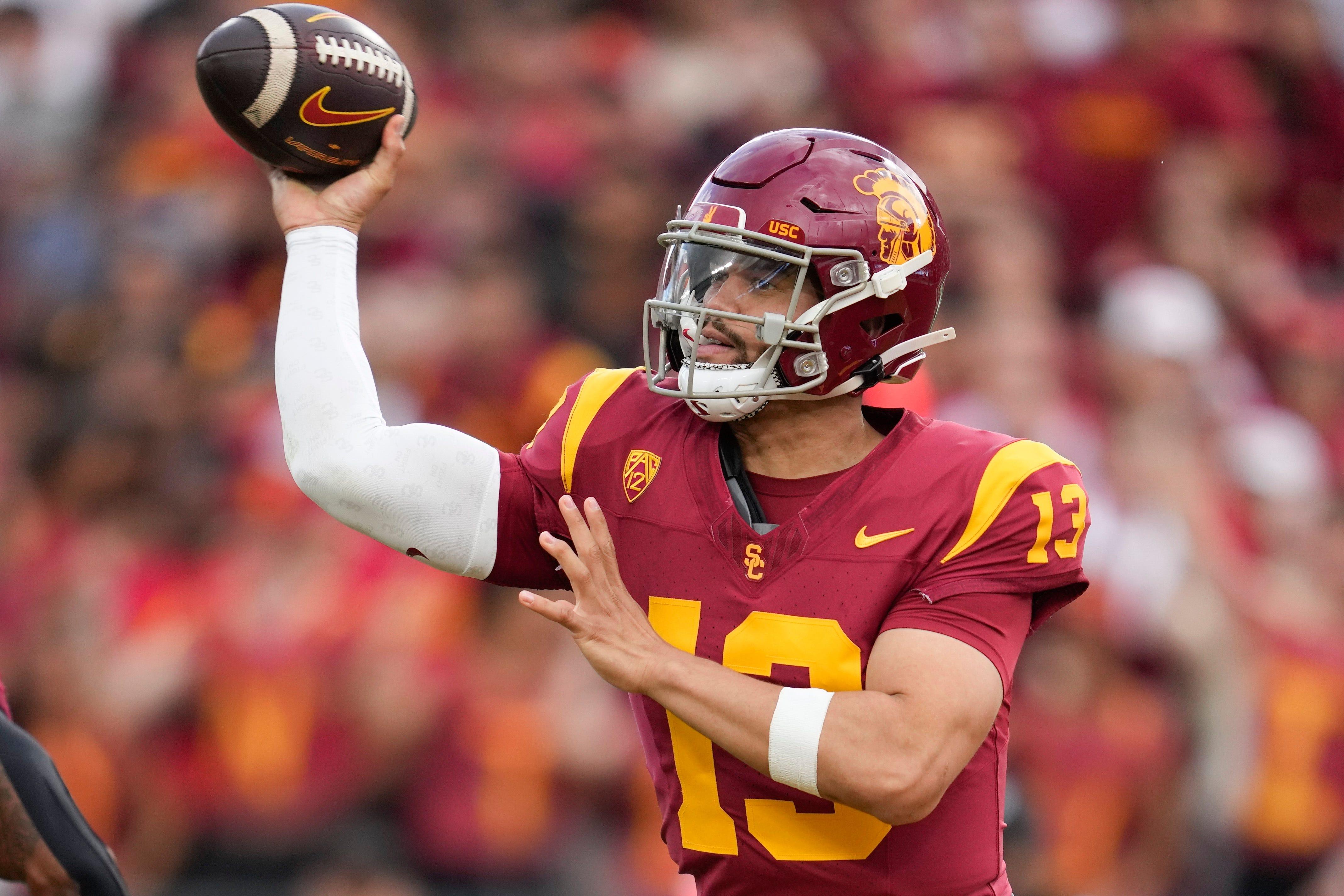 USC quarterback Caleb Williams (13) throws during the first half of an NCAA college football game against UCLA in Los Angeles, Saturday, Nov. 18, 2023. (AP Photo/Ashley Landis)