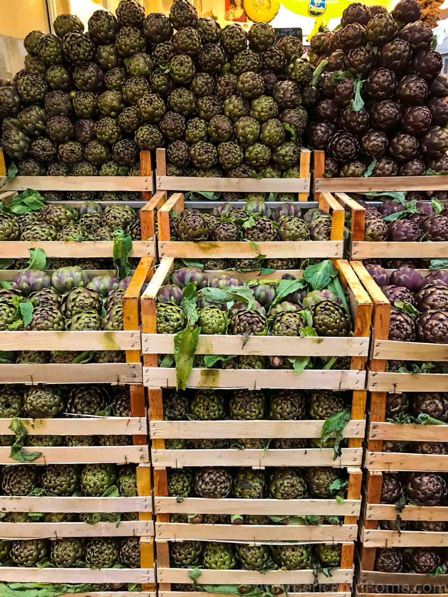 stacked crates and rows of artichokes in Rome