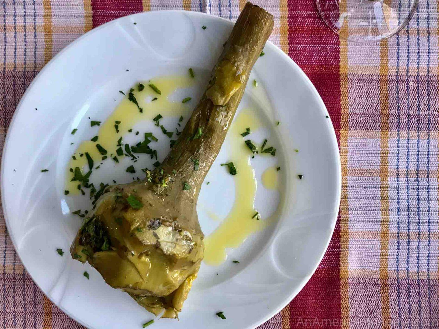 carciofi alla romana served as a whole artichoke in Rome on a white plate