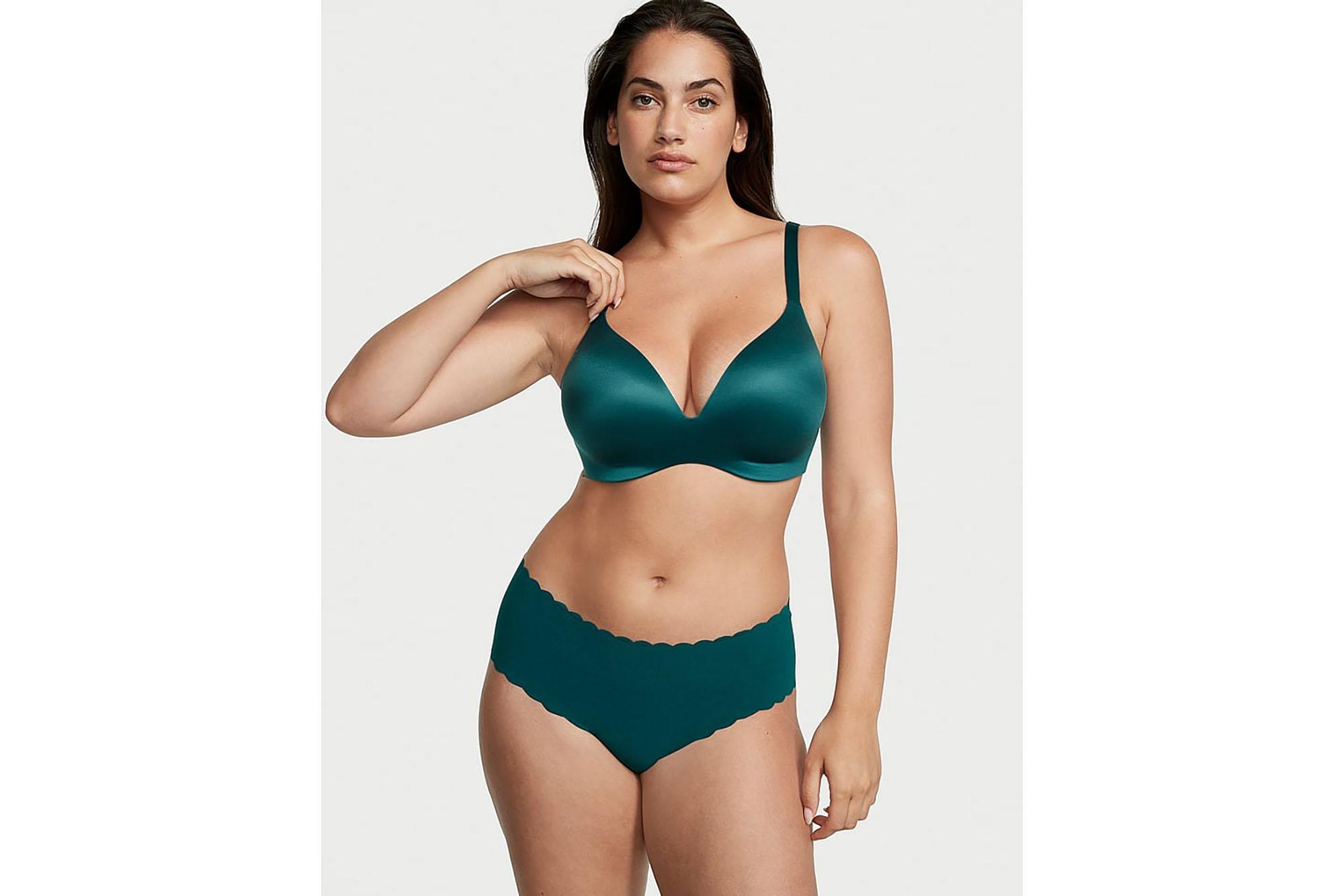 model wearing dark green bra and panties