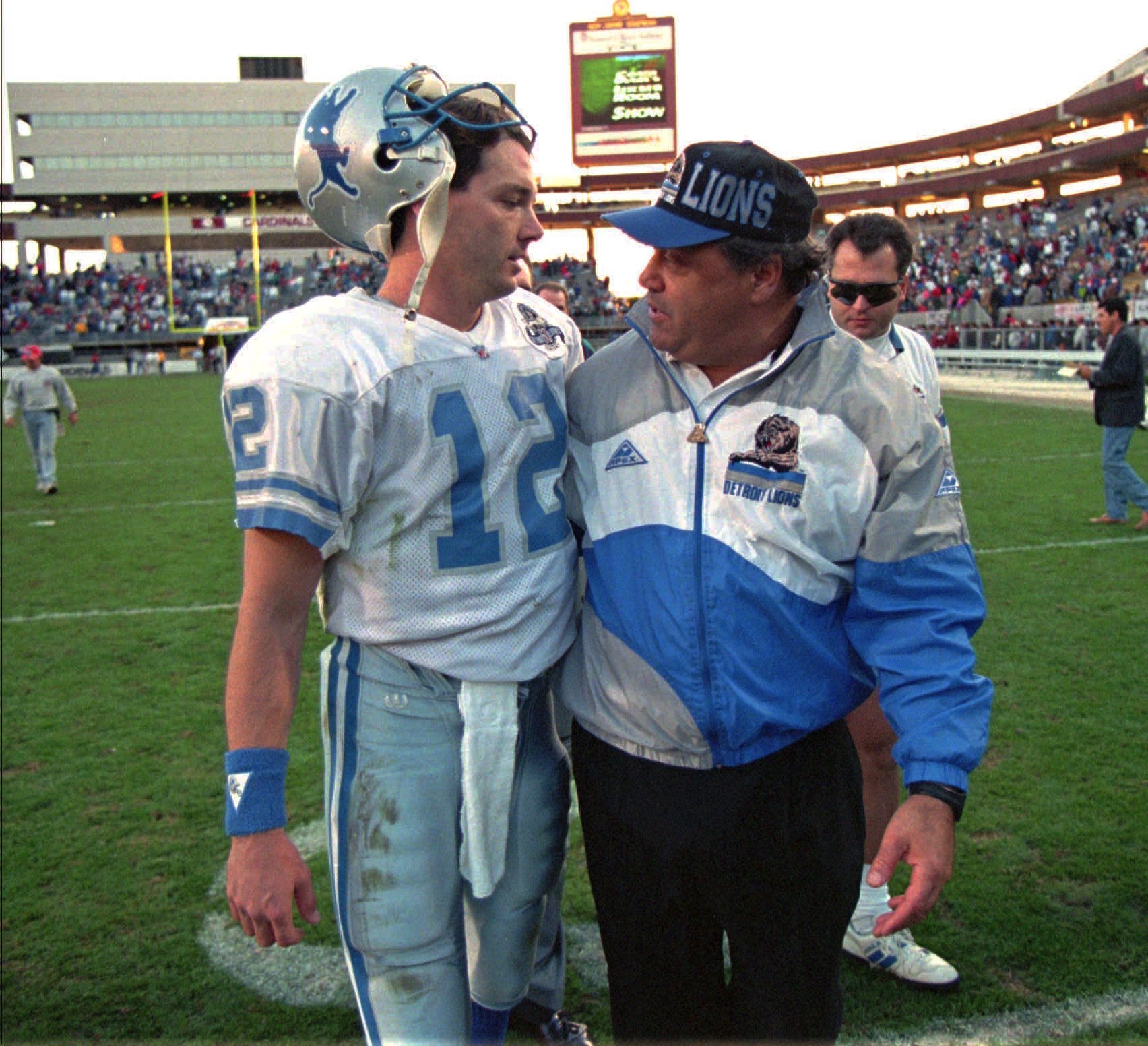 Detroit Lions coach Wayne Fontes, right, hugged QB Erik Kramer as they walked off the field after a 21-14 win over the Phoenix Cardinals, Dec. 12, 1993 at Sun Devil Stadium.