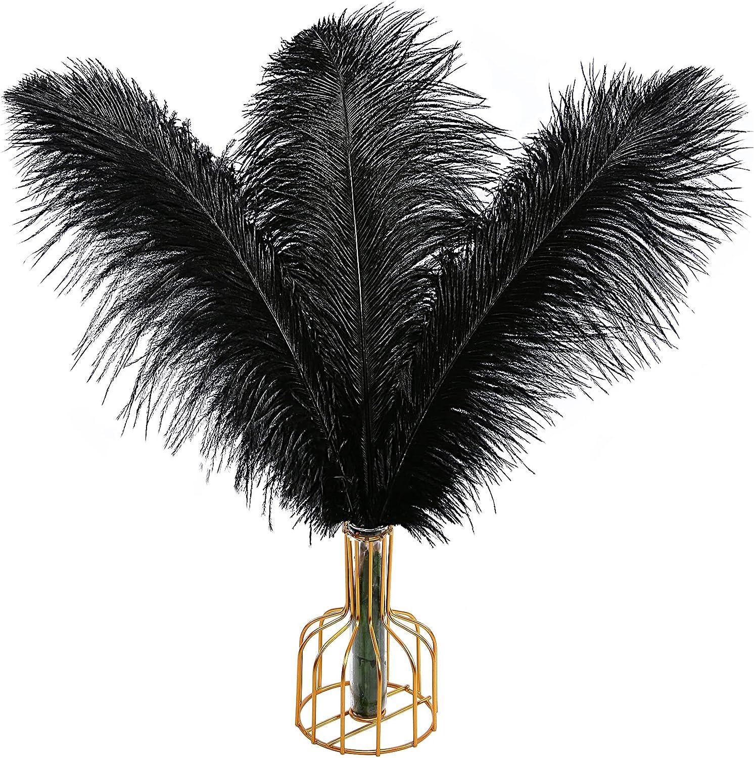 Black ostrich feathers in a gold vase symbolize the meaningful discovery of feathers.