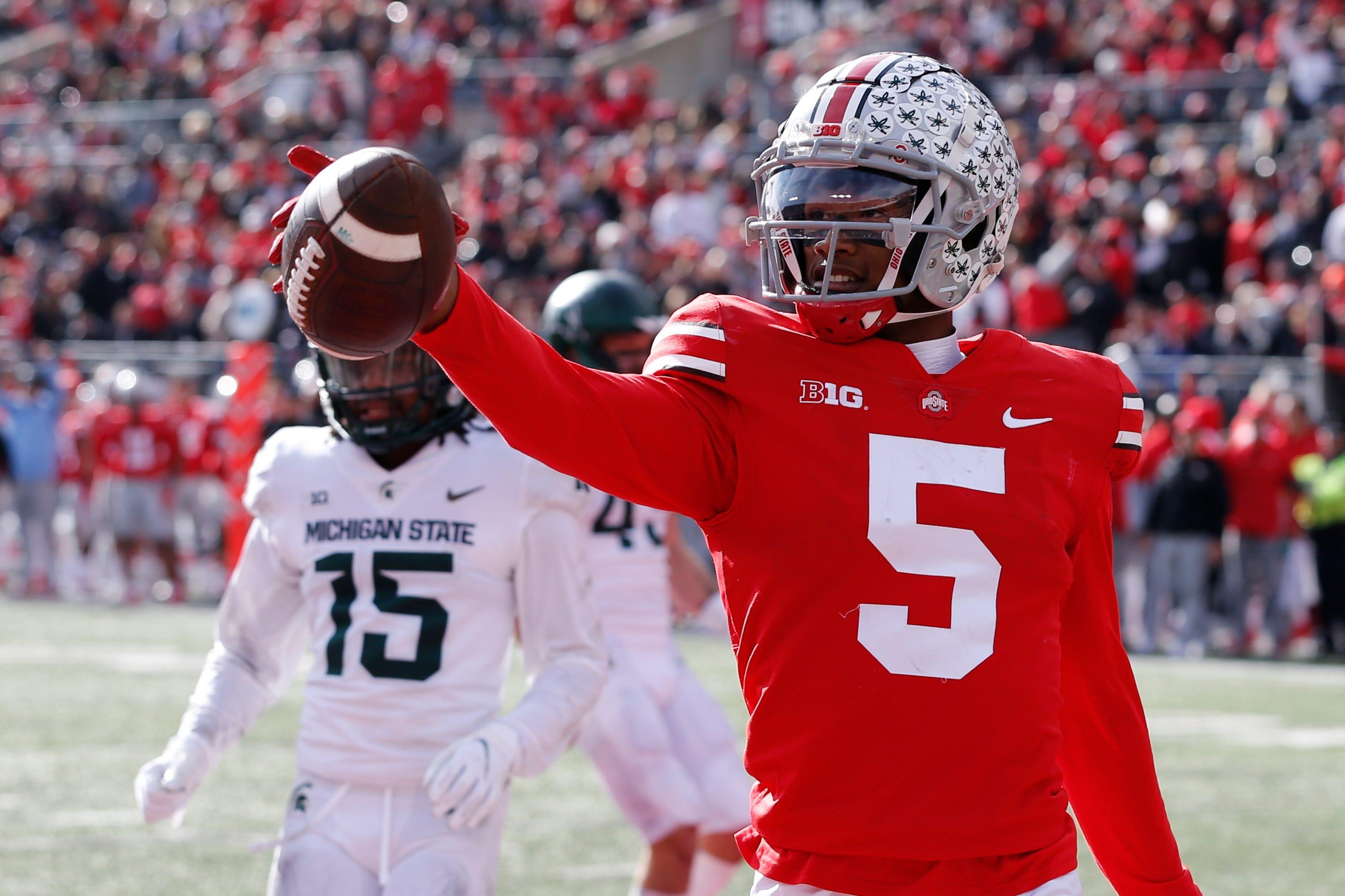 Ohio State receiver Garrett Wilson celebrates his touchdown against Michigan State during the first half of an NCAA college football game Saturday, Nov. 20, 2021, in Columbus, Ohio. (AP Photo/Jay LaPrete)
