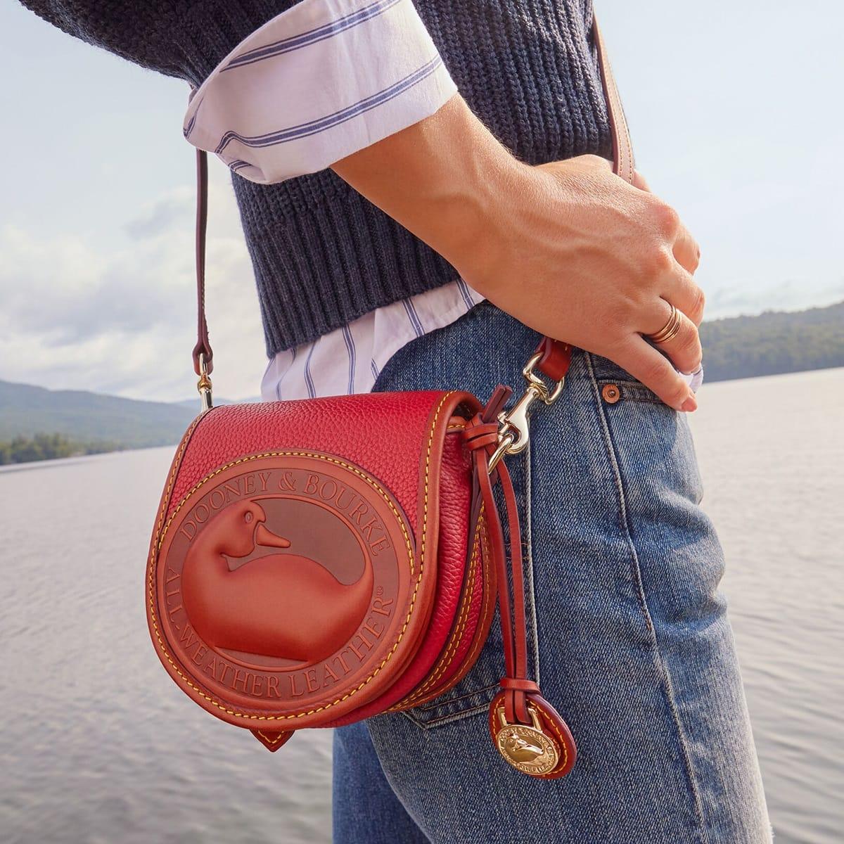 The "All Weather Leather" (AWL) was a defining characteristic of early Dooney & Bourke bags, and it was designed to repel water and resist the elements, much like a duck