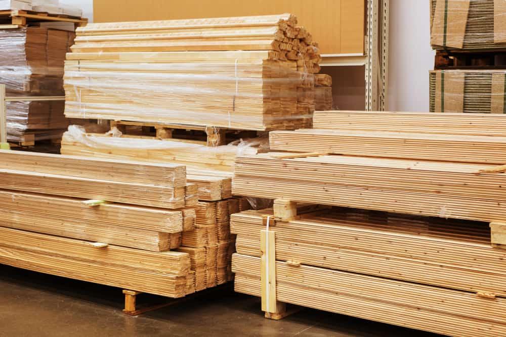 Stacks of wooden planks at building materials store