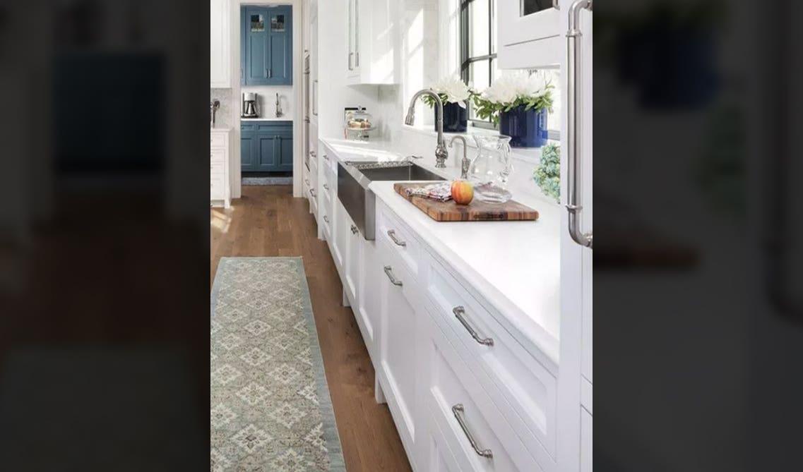 Detailed cabinet pulls on white kitchen cabinets