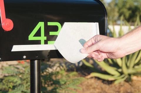 Applying peel-and-stick mailbox decals from Modern House Numbers