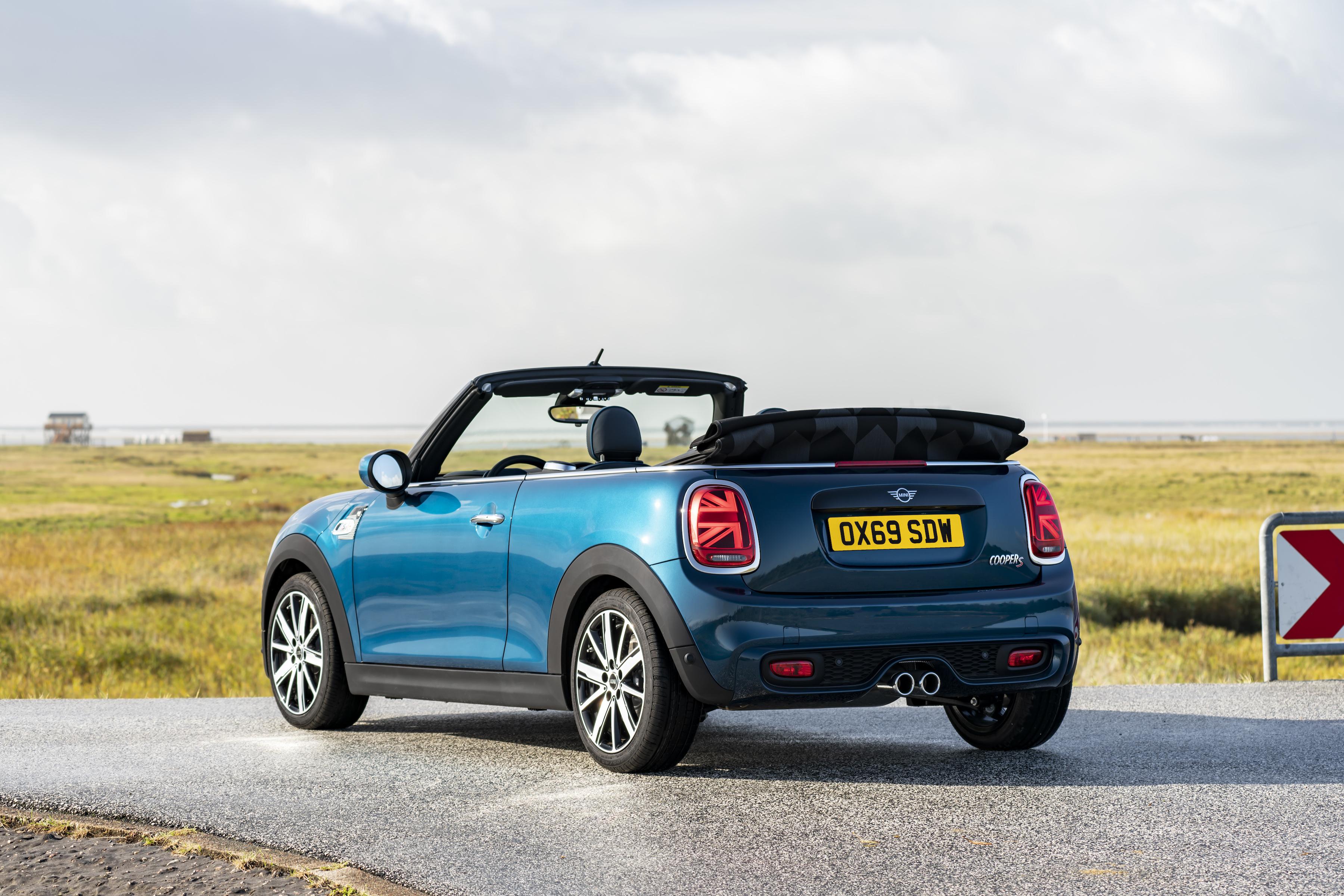 Mini Cooper Convertible parked near a beach