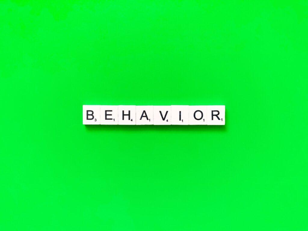 Behavior concept on green background