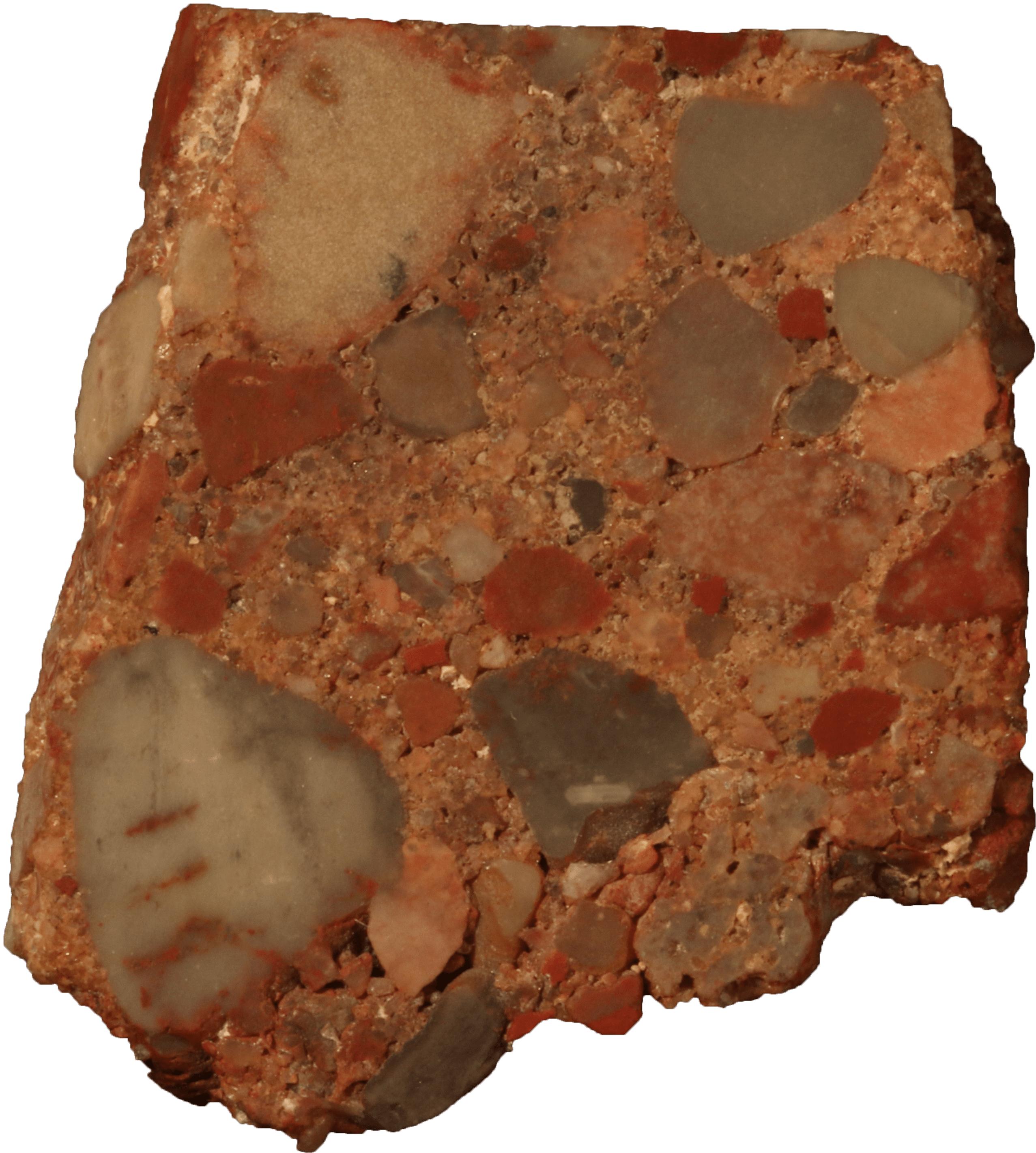 Conglomerate rock containing many smaller pieces.