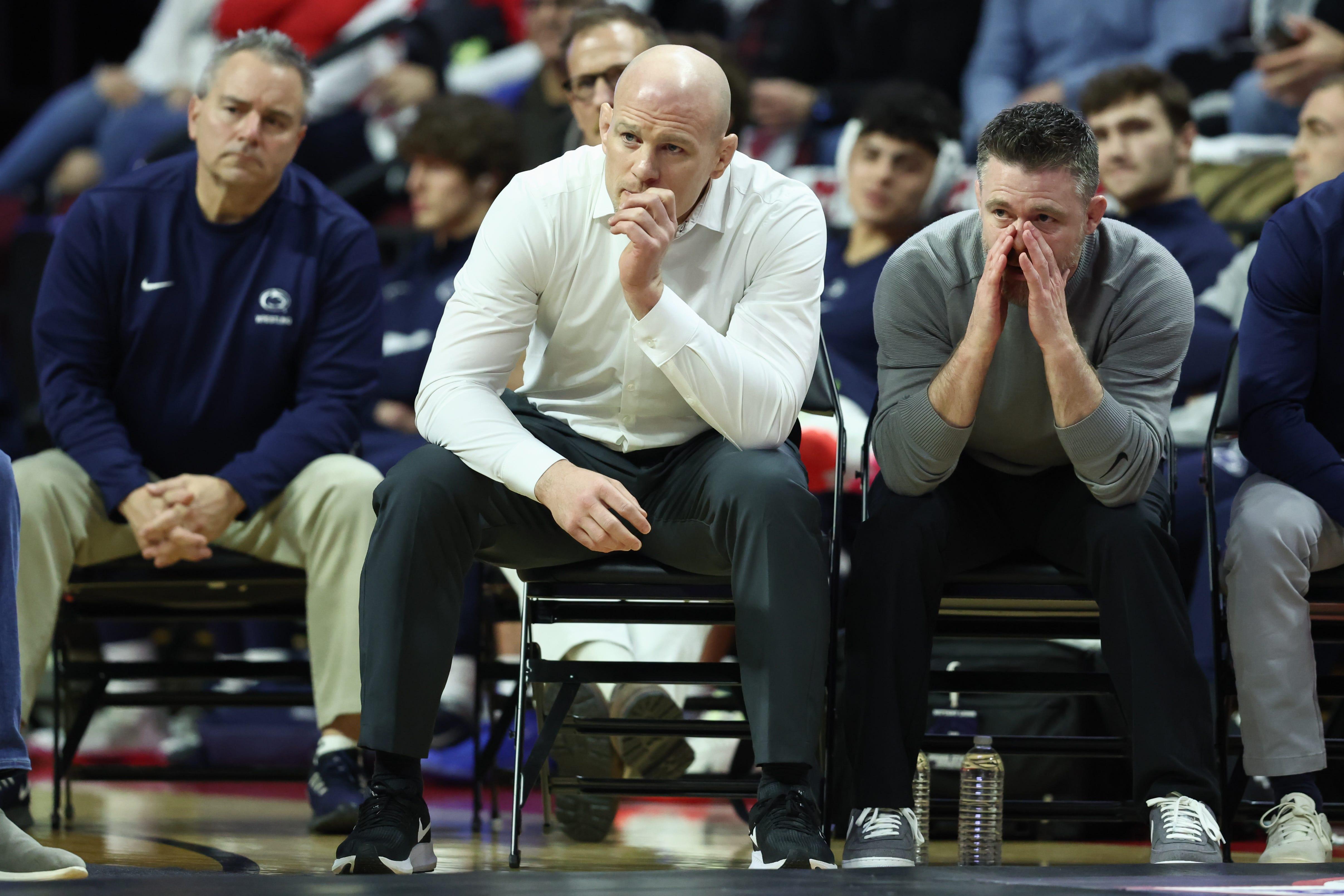Feb 10, 2023; Piscataway, NJ, USA; Penn State Nittany Lions head coach Cael Sanderson (center) looks on during the match against the Rutgers Scarlet Knights at Jersey Mike’s Arena. Mandatory Credit: Vincent Carchietta-USA TODAY Sports